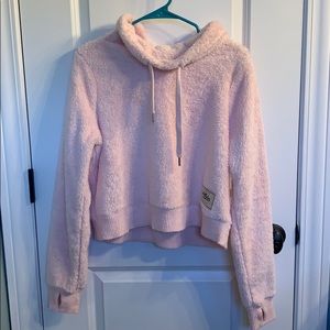 a pink fleece cropped Hollister sweatshirt